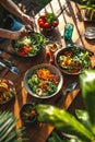 Group of friends eat variety of colorful chopped vegetables in bowl. Healthy raw food with nuts and vegetables.