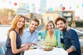 Group Of Friends Eating Meal On Rooftop Terrace Royalty Free Stock Photo