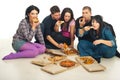 Group of friends eating pizza Royalty Free Stock Photo