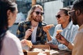 Group of Friends Eating Pizza Outdoors Royalty Free Stock Photo