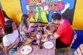 Group of friends eating typical Colombian food. Photo taken in Barranquilla