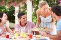 Group Of Friends Enjoying Meal outdoorss Royalty Free Stock Photo