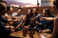 Group Of Friends Enjoying Night Out At Rooftop Bar Royalty Free Stock Photo