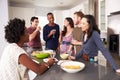 Group Of Friends Enjoying Pre Dinner Drinks At Home Royalty Free Stock Photo