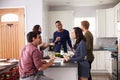 Group Of Friends Enjoying Pre Dinner Drinks At Home Royalty Free Stock Photo