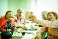 Group of friends enjoying red wine in speakeasy vintage bar - Young people hands cheering with wine and having fun hanging out - Royalty Free Stock Photo