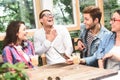 Group of friends enjoying talking together Royalty Free Stock Photo