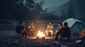 Group of friends enjoying their vacation near a campfire