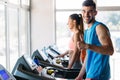 Group of friends exercising on treadmill machine Royalty Free Stock Photo