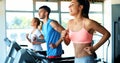 Group of friends exercising on treadmill machine Royalty Free Stock Photo