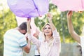 Group of friends floating chinese lanterns Royalty Free Stock Photo