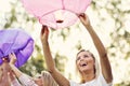 Group of friends floating chinese lanterns Royalty Free Stock Photo