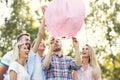 Group of friends floating chinese lanterns Royalty Free Stock Photo