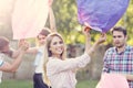 Group of friends floating chinese lanterns Royalty Free Stock Photo