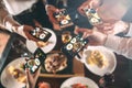 Group of friends going out and taking a photo of food together with mobile phone Royalty Free Stock Photo