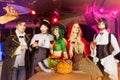 Group of friends in halloween costumes