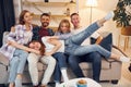Group of friends have party indoors together Royalty Free Stock Photo