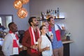 Group of friends having beer while watching match at bar restaurant Royalty Free Stock Photo