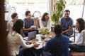 Group of friends having coffee together at a coffee shop Royalty Free Stock Photo