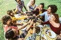 Group of friends having fun at bbq dinner in garden restaurant Royalty Free Stock Photo