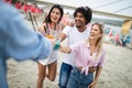 Group of friends having fun on the beach. Summer, fun, people, vacation concept. Royalty Free Stock Photo