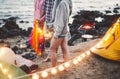 Group friends having fun camping next the sea - Happy young people doing barbecue party in camp village Royalty Free Stock Photo