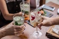 Group of friends having fun and drink cocktails. Royalty Free Stock Photo