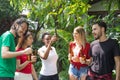 Group of friends having fun and happy in barbecue party at house backyard Royalty Free Stock Photo