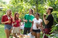 Group of friends having fun and happy in barbecue party at house backyard Royalty Free Stock Photo