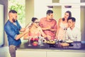 Group of friends having fun at house party with pre dinner aperitif cocktails and eating snacks - Young people spending time Royalty Free Stock Photo