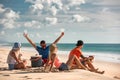 Group of friends at sea beach picnic Royalty Free Stock Photo