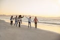 Group Of Friends Having Fun Running Along Winter Beach Together Royalty Free Stock Photo