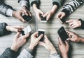 Group of friends having fun together with smartphones - Closeup of hands social networking with mobile phones - Technology and