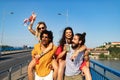 Group of friends having fun, traveling, smiling together outdoors Royalty Free Stock Photo