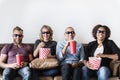 Group of friends having fun watching movie together