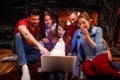 Group of friends having fun watching movie together on laptop Royalty Free Stock Photo