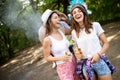 Group of friends having a picnic in a park outdoor. Happy young people enjoying bbq Royalty Free Stock Photo