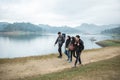 Group of friends on hiking enjoy lake view