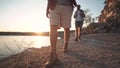 Group of friends hiking on rocky coastline