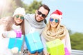 Group of friends holding Christmas presents Royalty Free Stock Photo