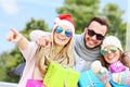 Group of friends holding Christmas presents Royalty Free Stock Photo