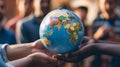group of friends holding a globe in their hands, close-up Royalty Free Stock Photo