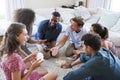 Group Of Friends At Home Playing Cards Together Royalty Free Stock Photo