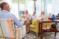 Group Of Friends At Home Relaxing In Lounge With Cold Drinks Royalty Free Stock Photo