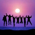 Group of friends jumping against sunset Royalty Free Stock Photo