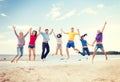 Group of friends jumping on the beach Royalty Free Stock Photo