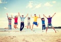 Group of friends jumping on the beach Royalty Free Stock Photo