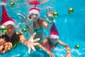 Group of friends l wearing Christmas Santa hats Royalty Free Stock Photo