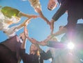 A group of friends make a circle shape out of their hands. The concept of world peace. Royalty Free Stock Photo