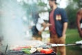 Group of friends making barbecue in the backyard. concept about good and positive mood with friends Royalty Free Stock Photo